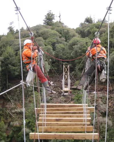 The Avalon team building a swing bridge